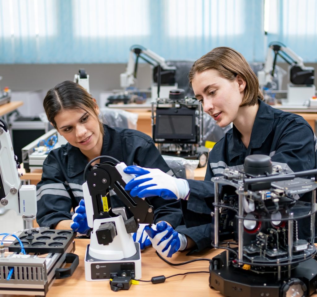 female-engineer-man-working-at-industrial-robot-in-factory-industrial-robotic-and-manufacturing.jpg